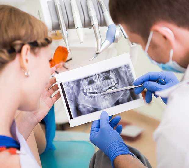 technicians looking at dental x-ray
