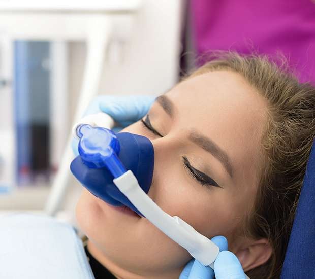 female patient receiving dental sedation